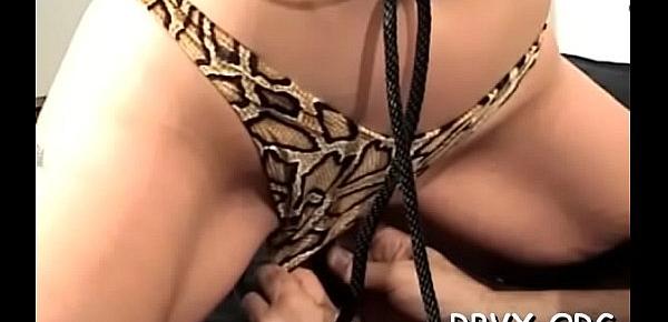  Raunchy woman forces dildo in her tight honey pot